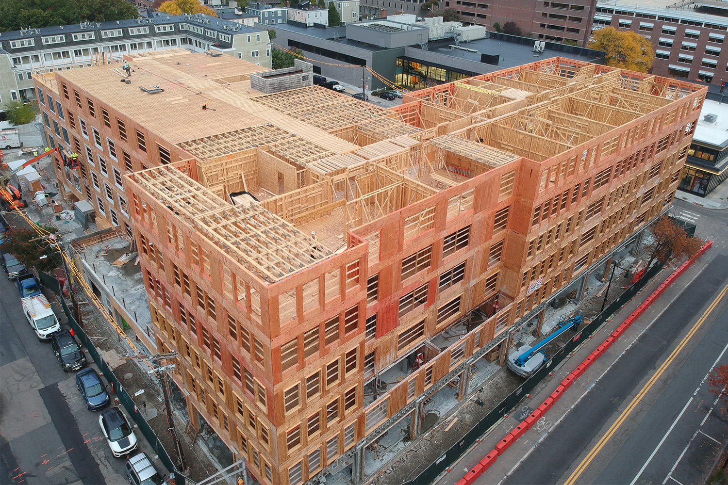 Daytime drone view of the base of the walls at Flats on First, completed