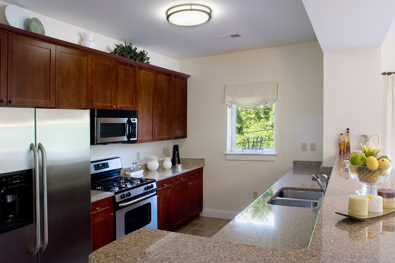 Kitchen with mahogany cabinets and granite countertops 