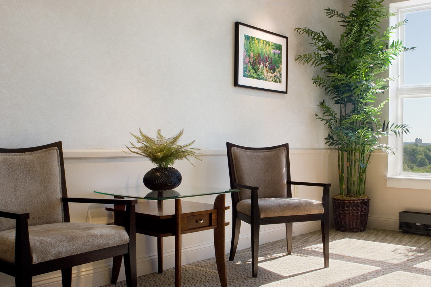 Elegant cream colored lobby with seating and planters 