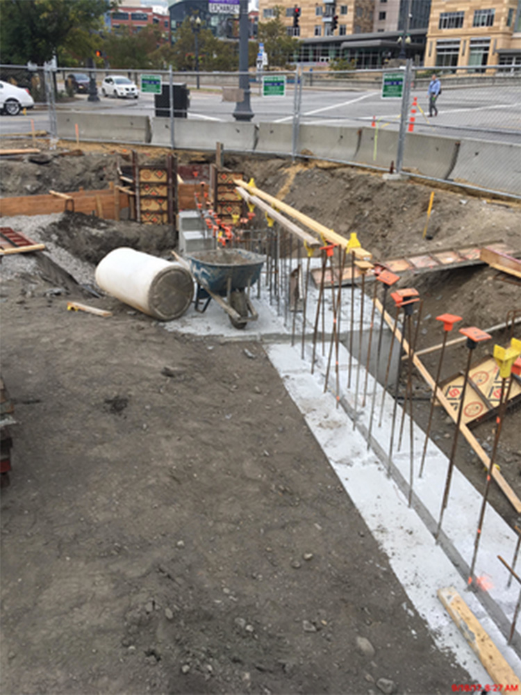 Concrete pours next to wheel barrel 