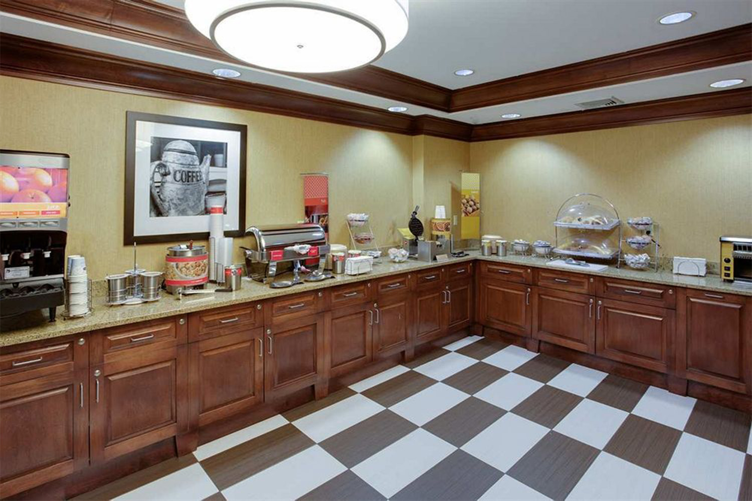 Breakfast area of hotel with checkerboard floor 