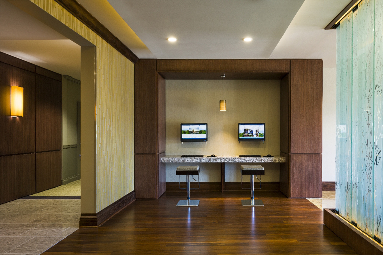 Business center room with 2 computers on a granite countertop