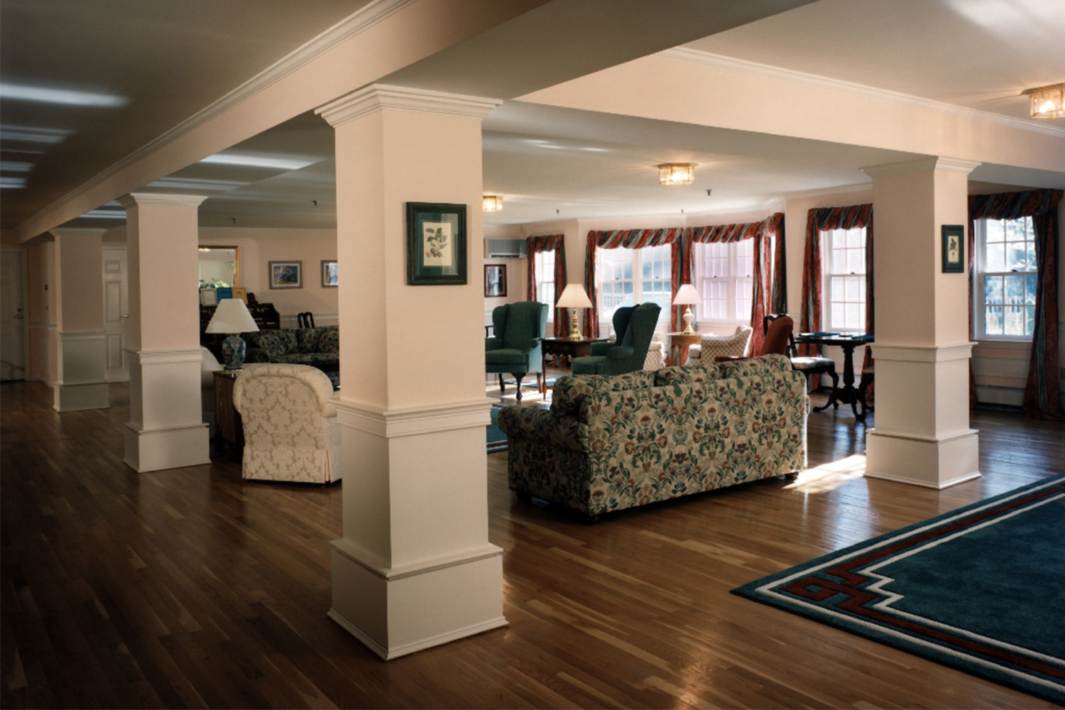 Lounge area with pillars throughout, and plush seating 