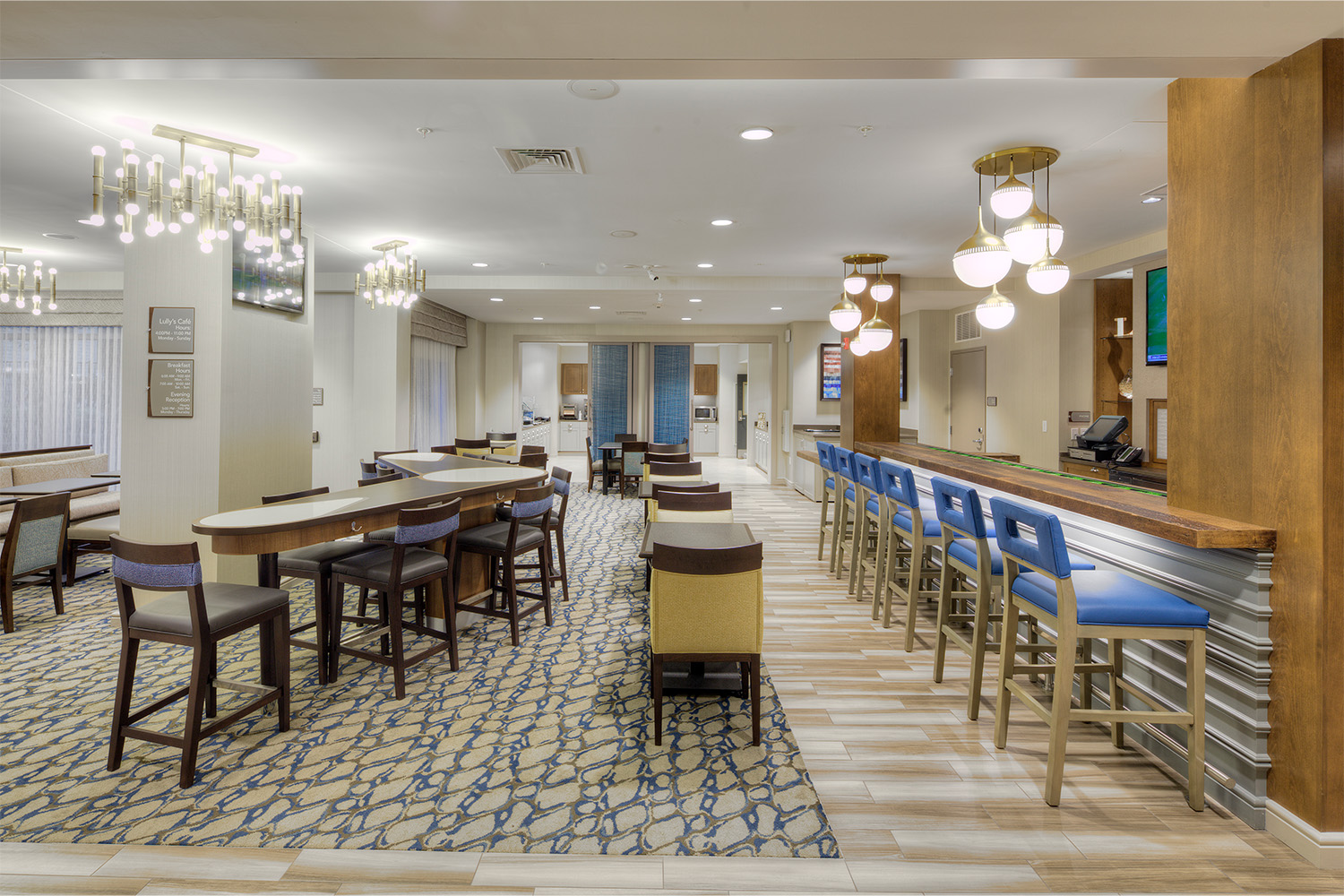 Café area with seating, next to bar table and seating 