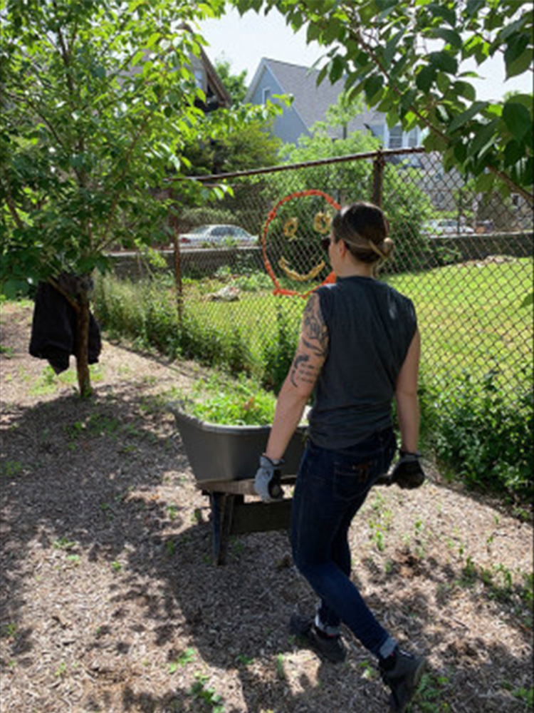 Tocci employee pushing wheel barrel 