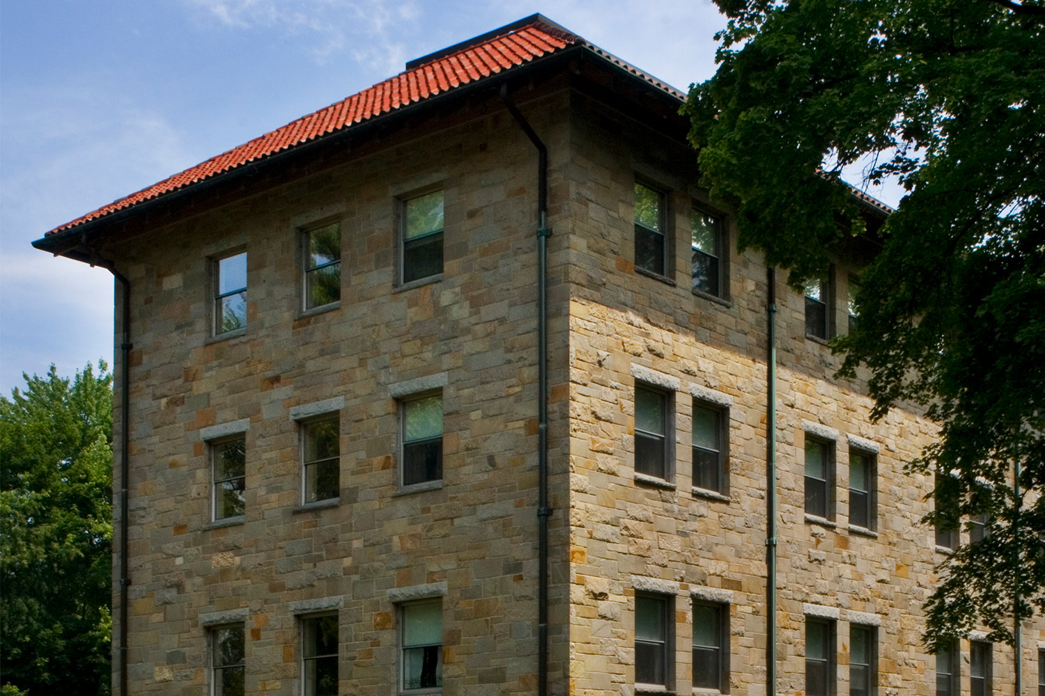 Angled view of side exterior, with red roof tiling