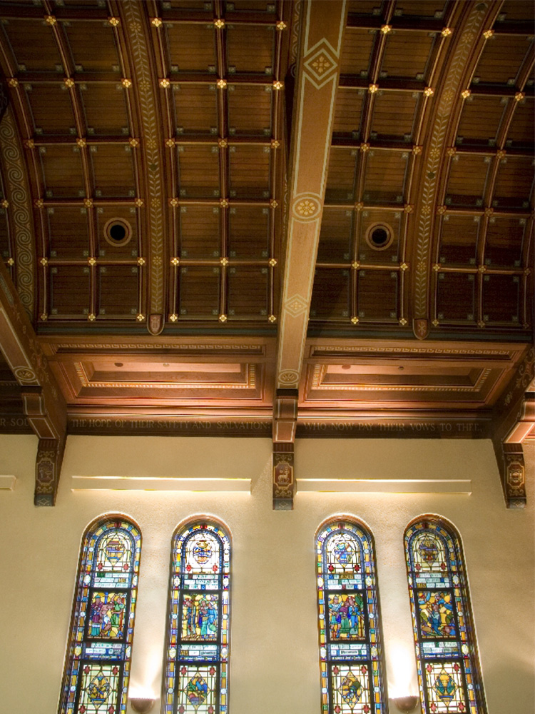 Zoomed-in view of woodwork detailing in chapel ceiling 