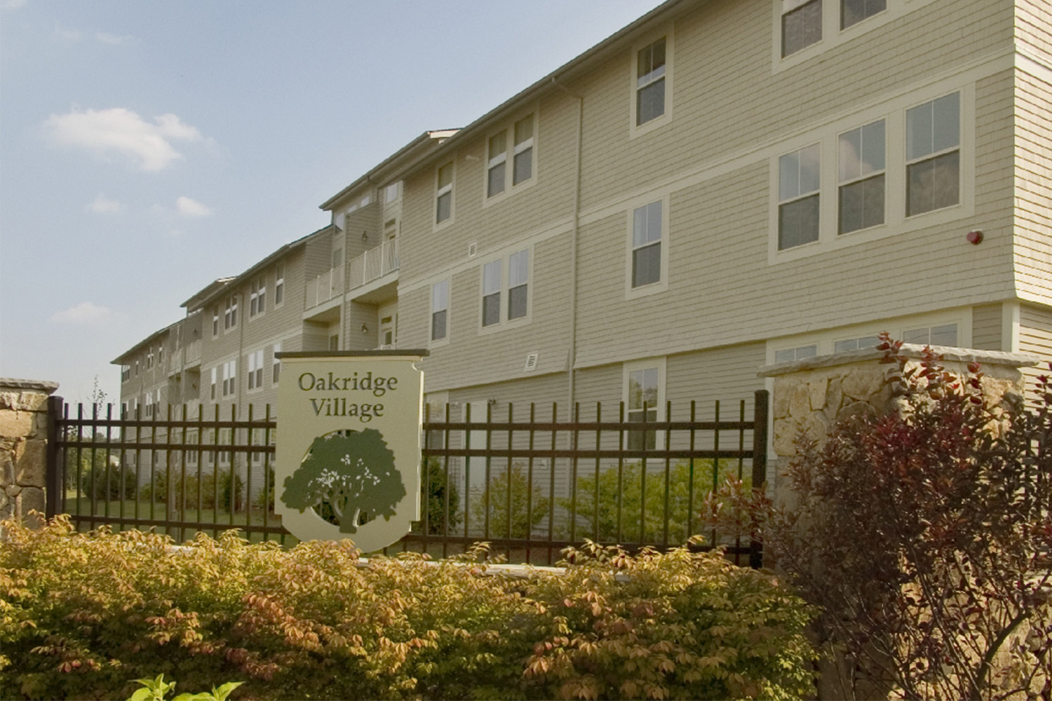 Sign saying "Oakridge Village" at the neighborhood entryway 