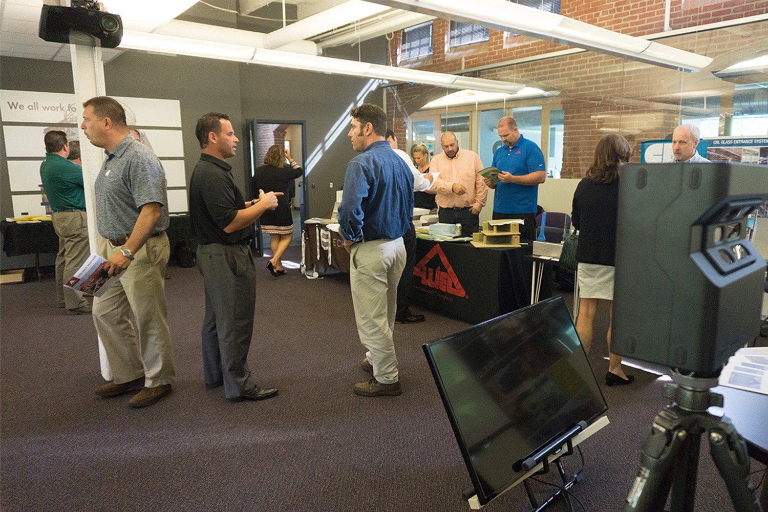 Several people chatting at tradeshow 