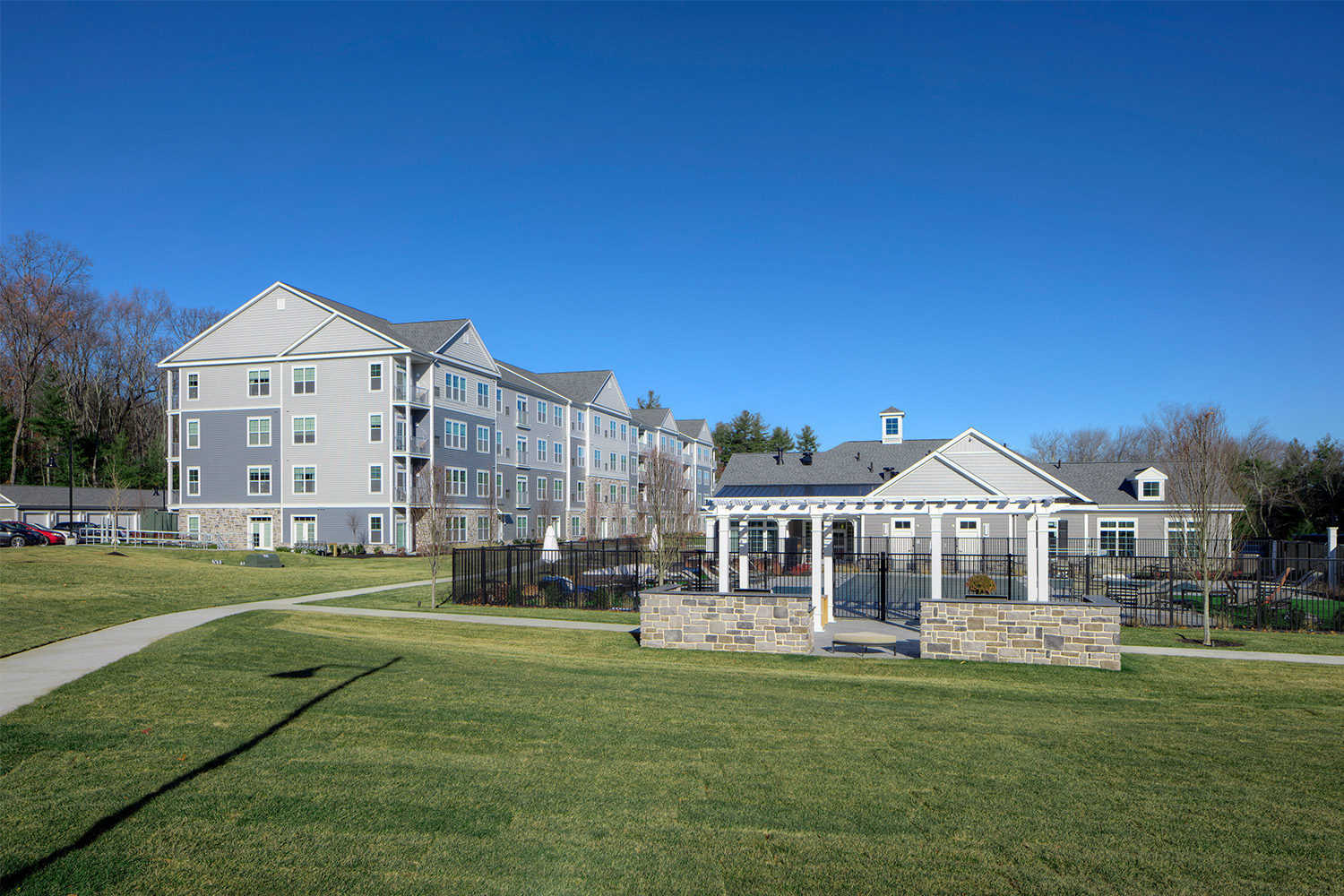 Sideview of townhouses and terrace on a with walkways throughout the neighborhood