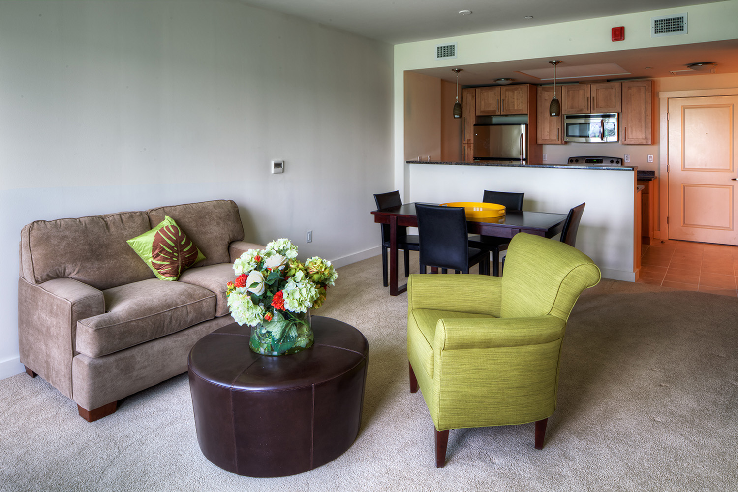 Living room with soft brown couch and lime-green chair