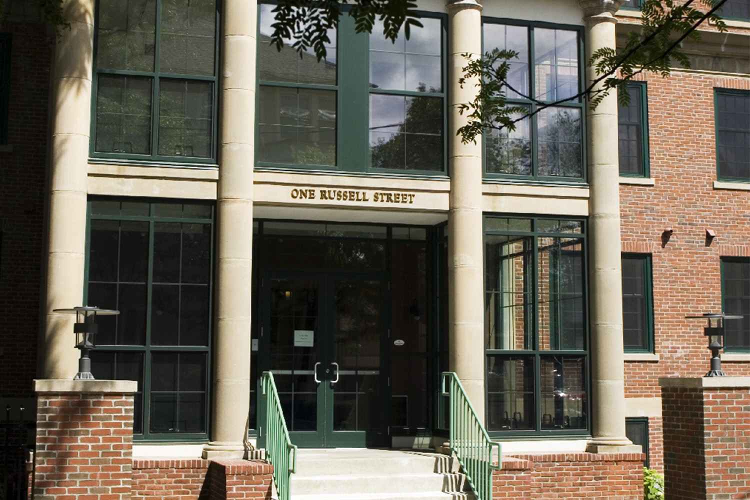 Stairs leading up to outside entrance, with pillars on the sides