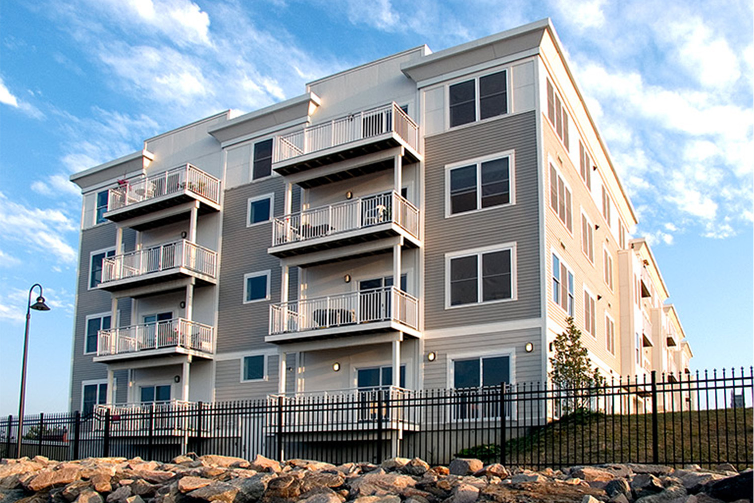 Exterior sideview, with 6 wide balconies on building 