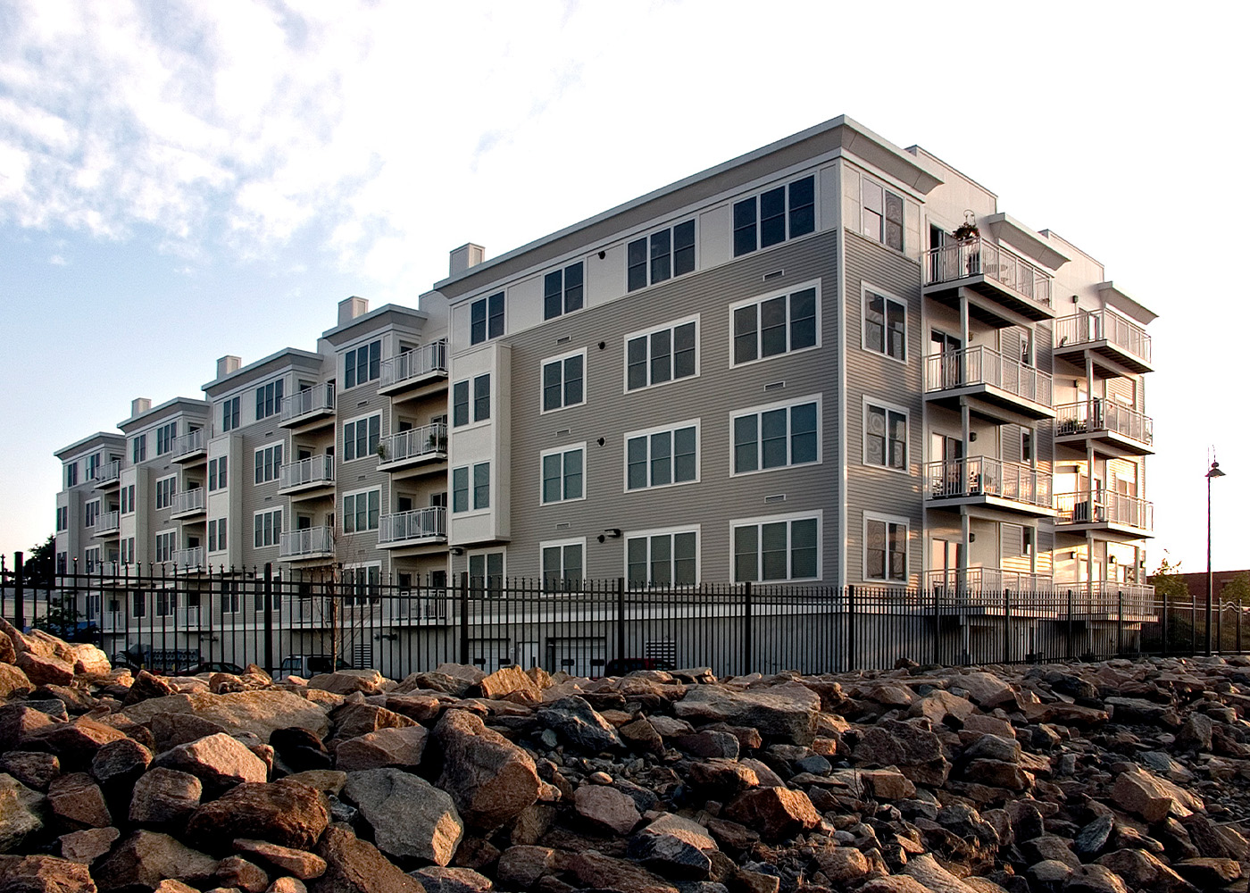 Shaw's Landing side exterior with sun in the background