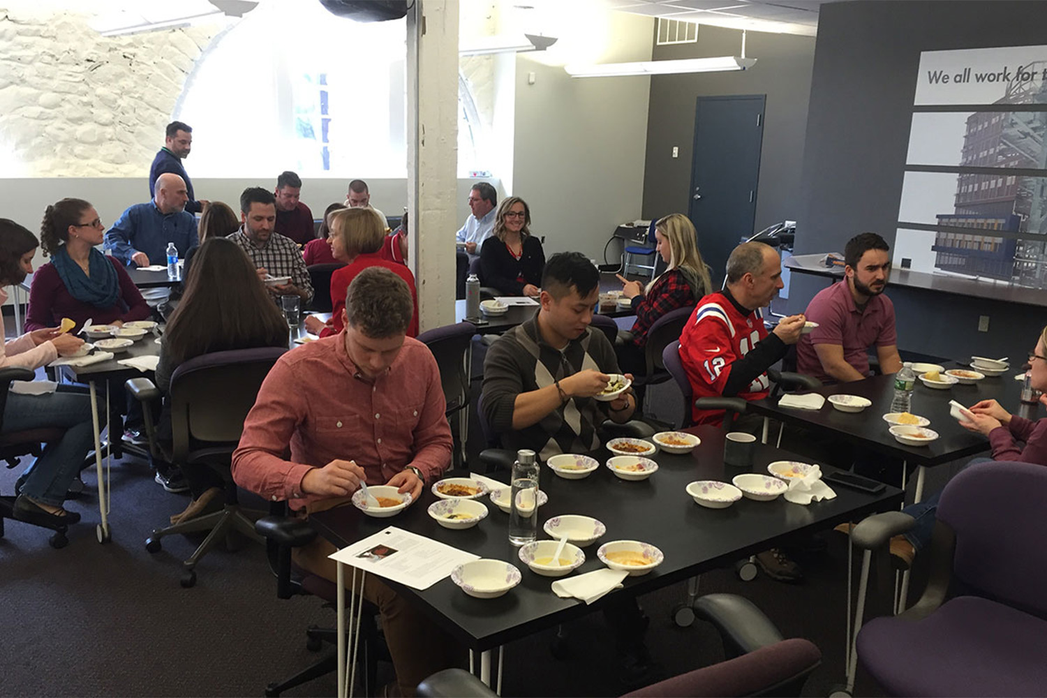 Tocci employees chatting as they enjoy soup