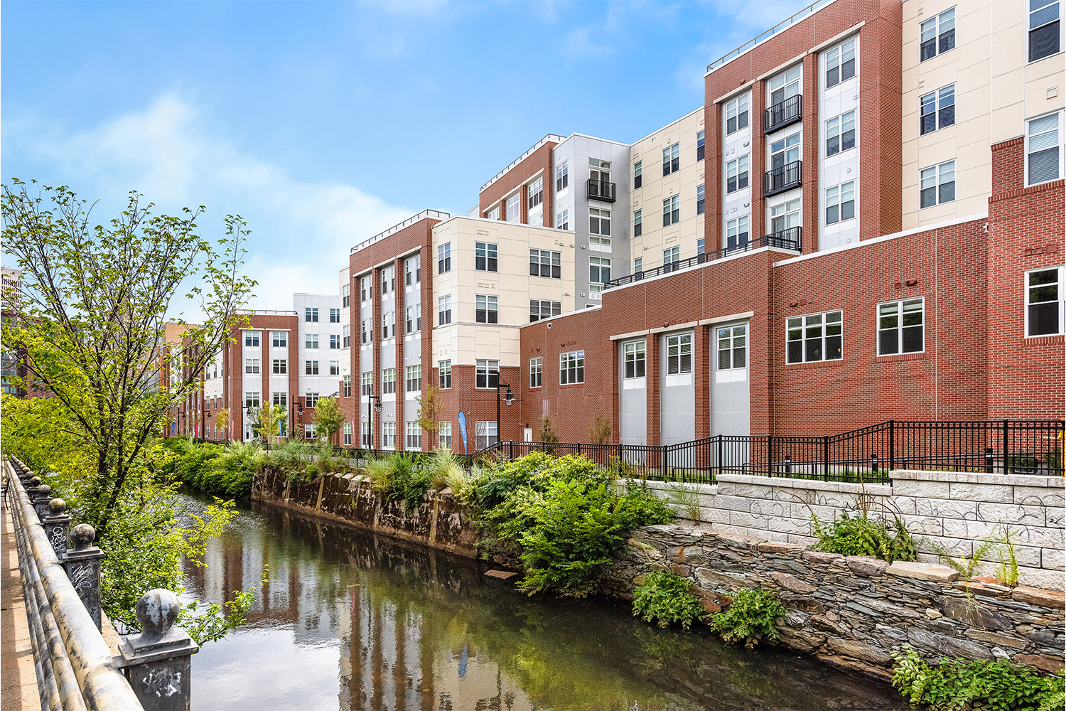 View of rows of townhouses seen from across water canal 