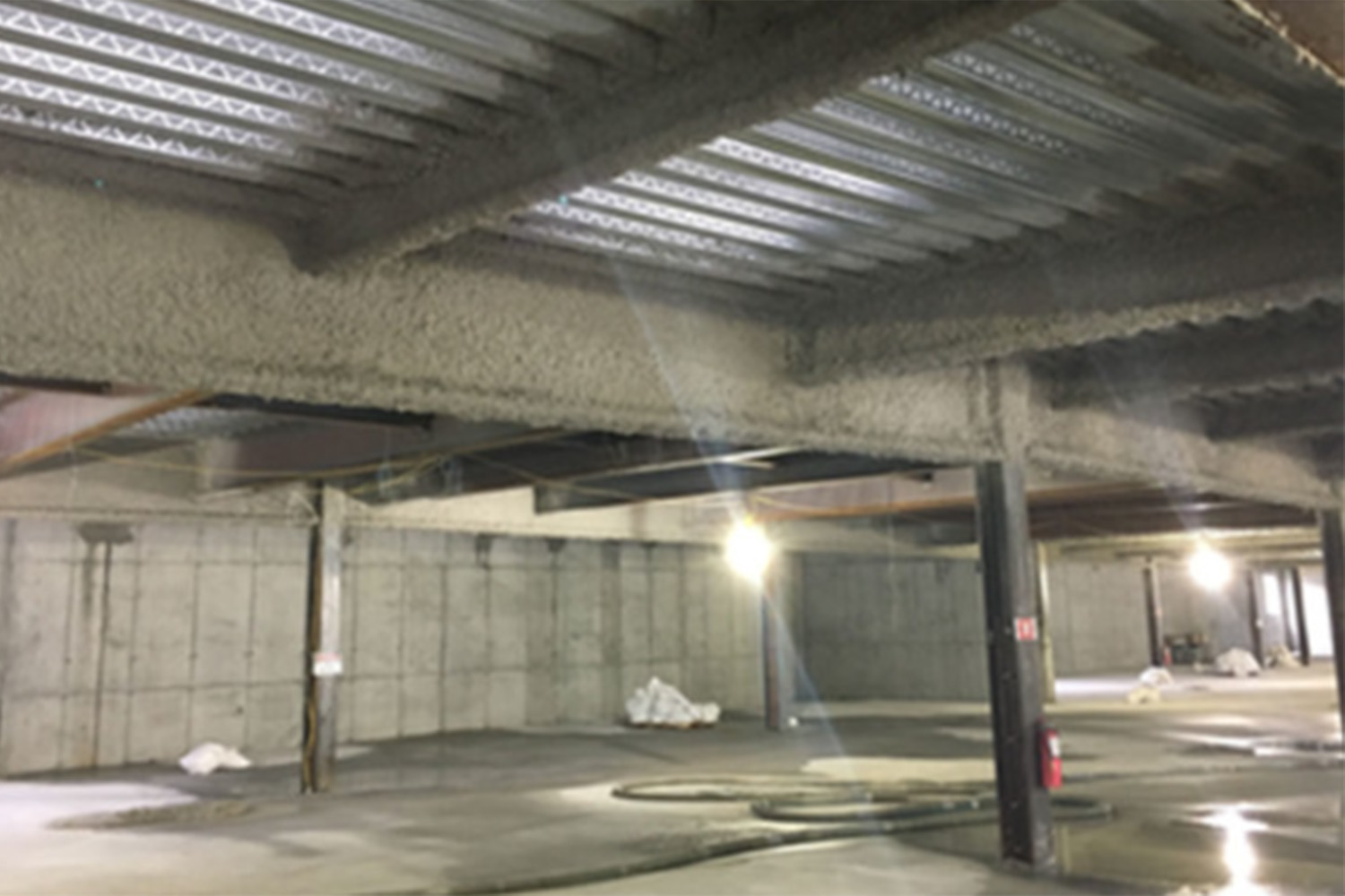 Parking garage area with concrete pillars