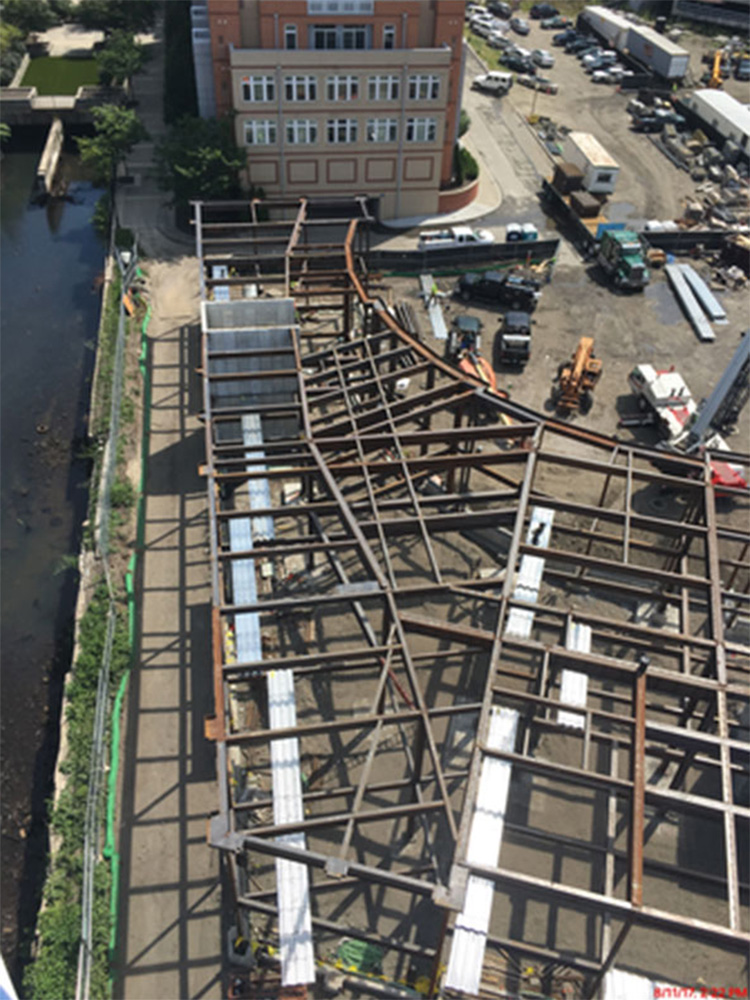 Metal support beams in construction area, seen from a drone