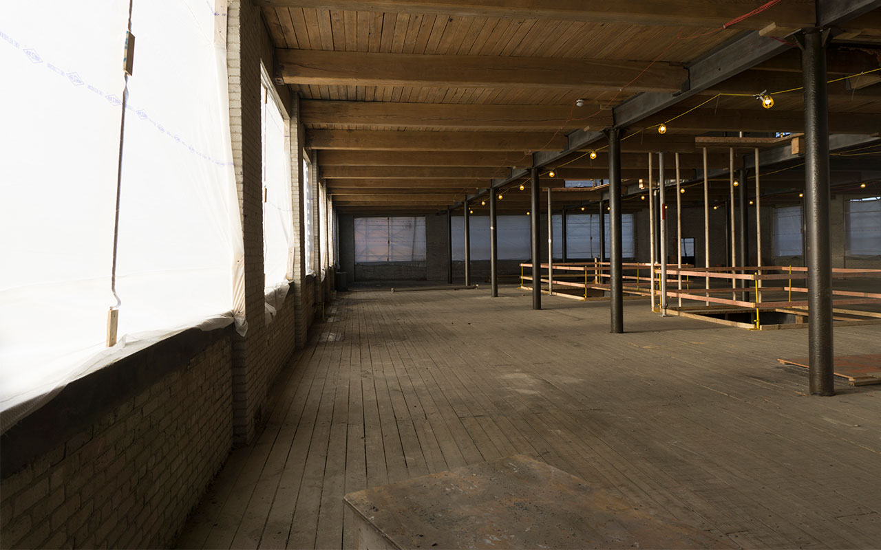 long empty hallway under construction at The Graphic