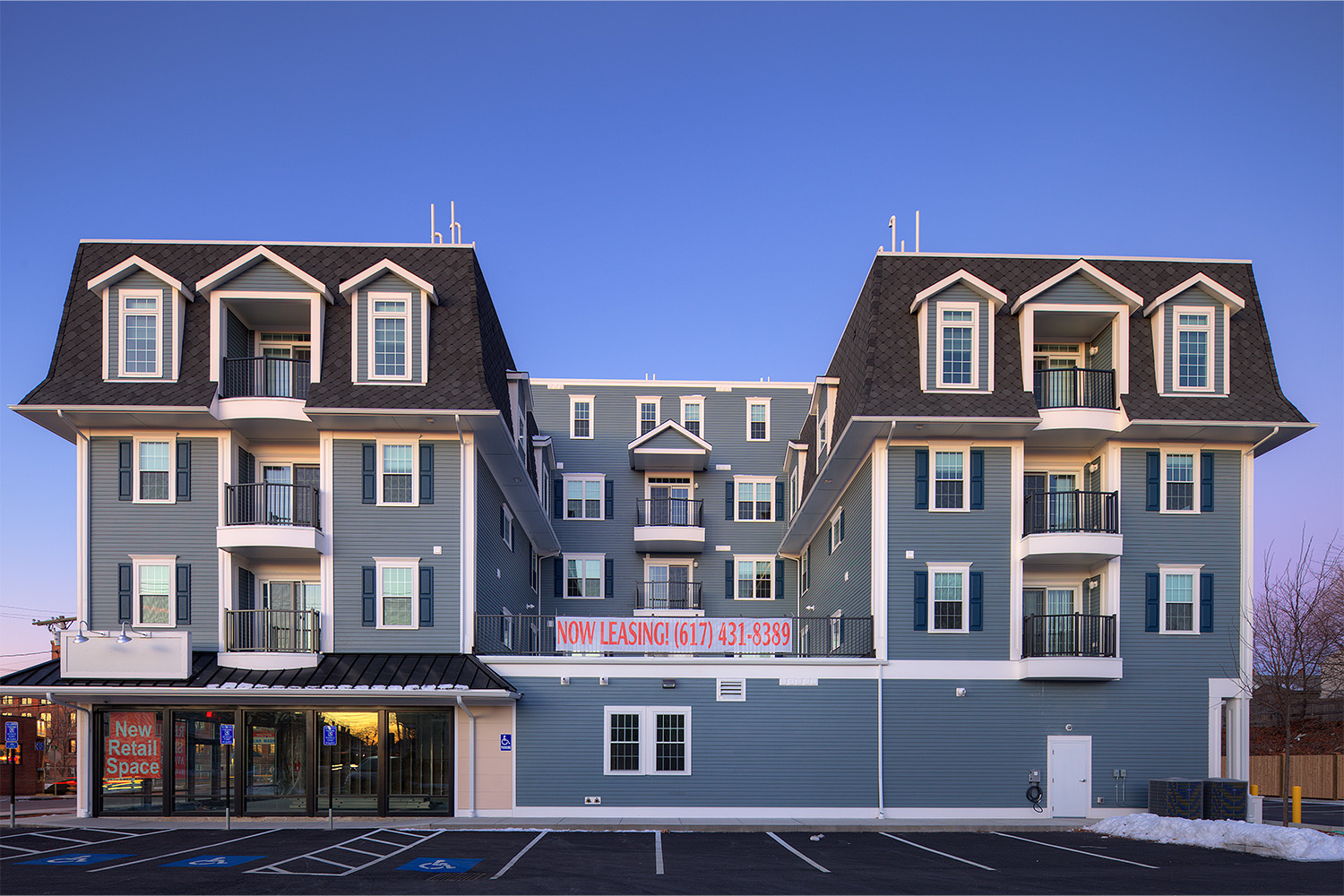 View of building's front exterior at midafternoon 