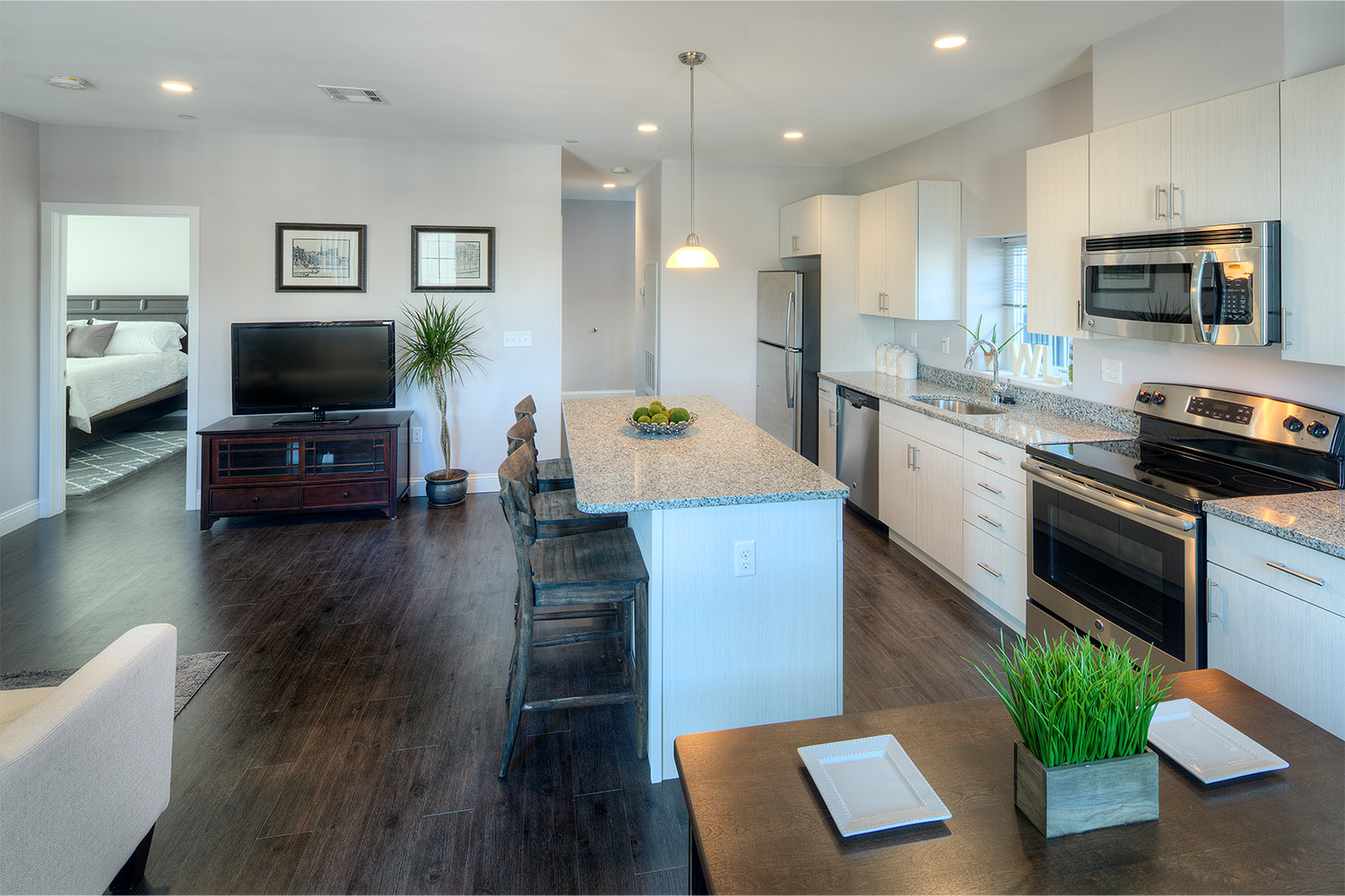 Minimalist kitchen with white granite countertops 