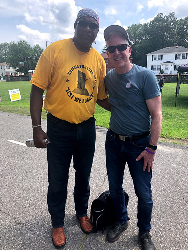 John Tocci posing with member of Buffalo Soldiers Motorcycle club 