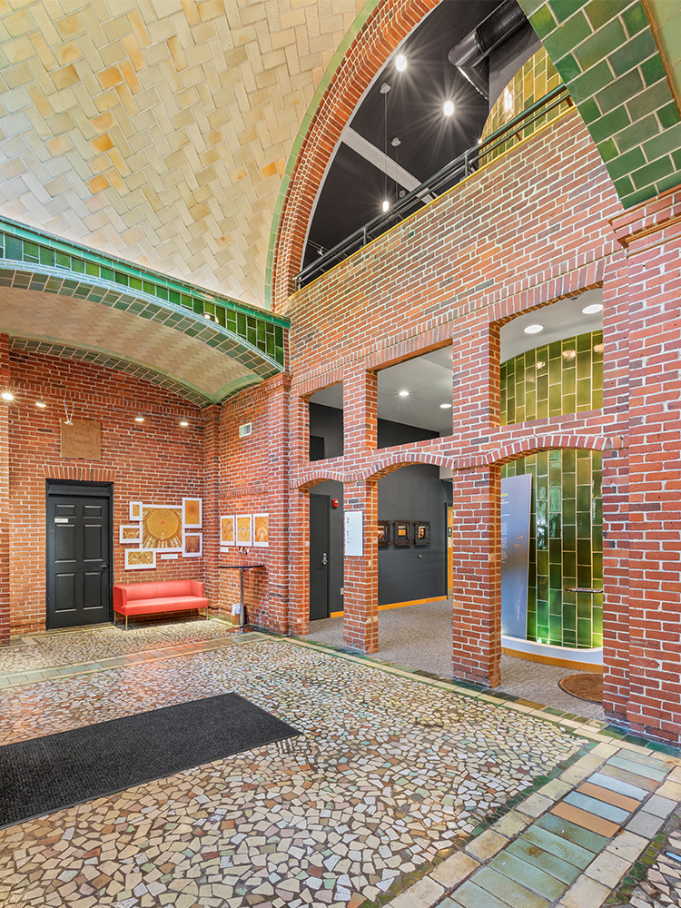 660 Main Street's lobby, featuring brick arch ways and main tile arch above-head