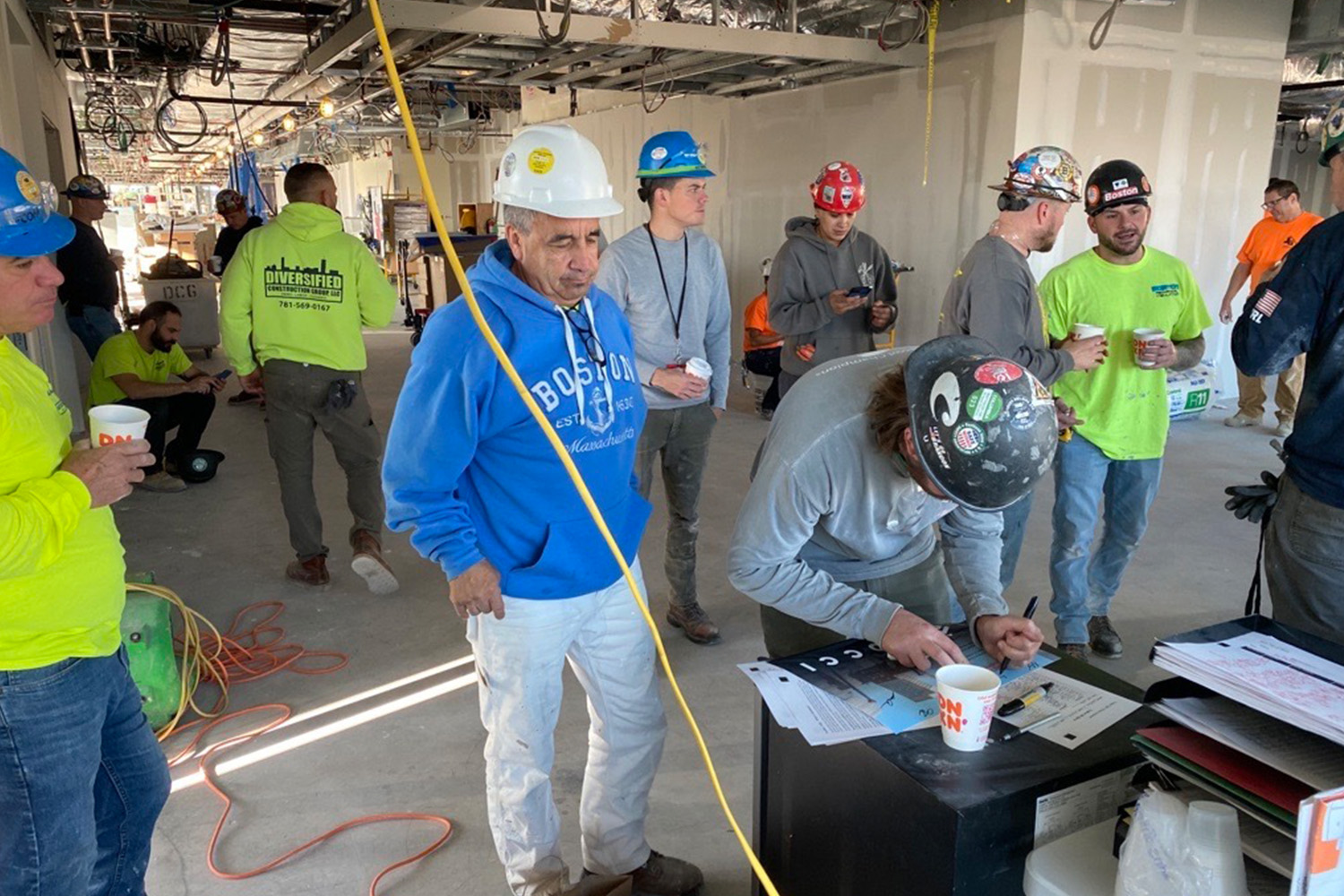 TOCCI staff and subcontractors sign the Culture of CARE pledge at a Boston jobsite