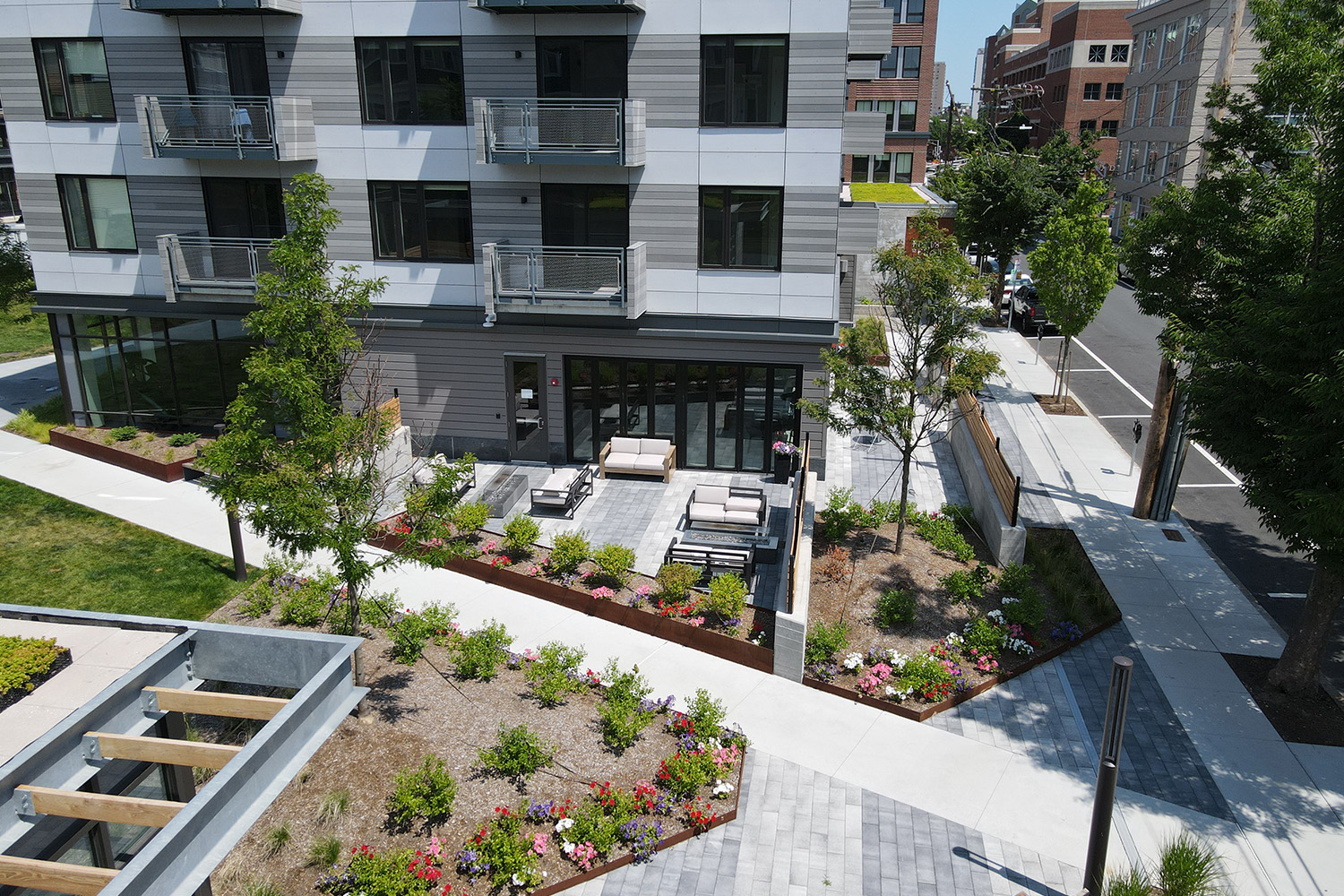 Vantage point view of outdoor amenities, including fireplace and seating at Flats on First 