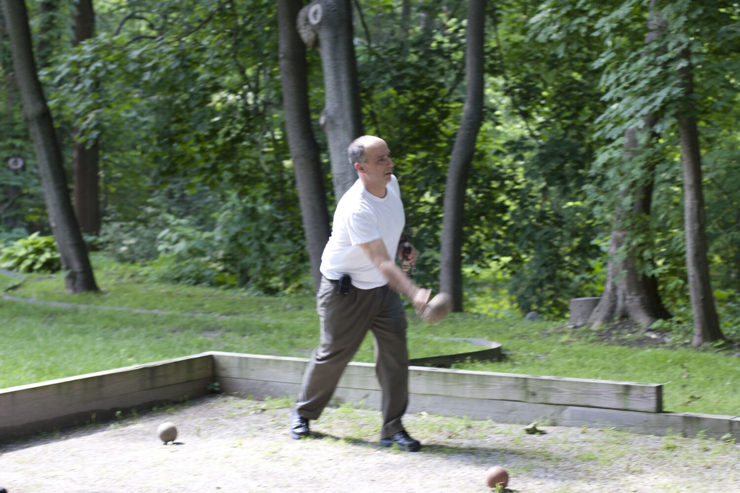 Tocci employee throwing bocce ball 
