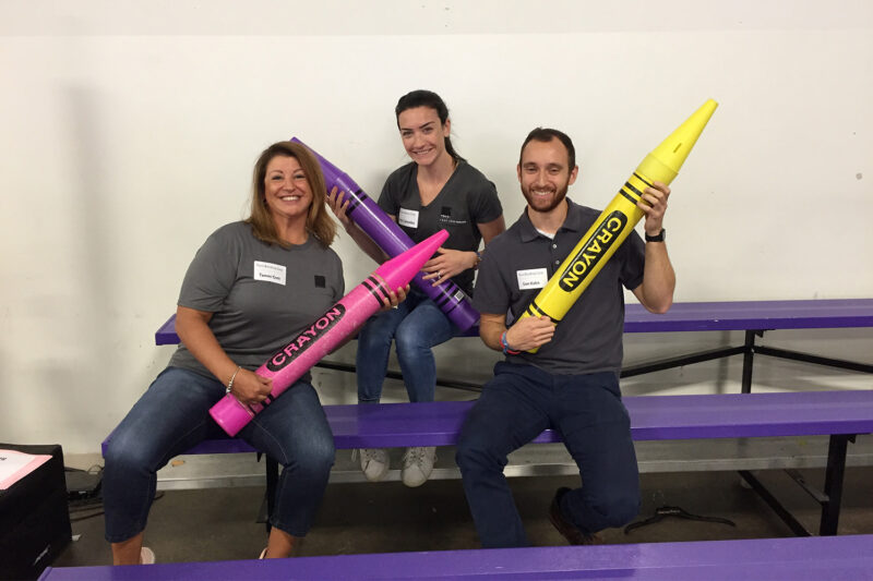 Tocci employees pose for Cradles to Crayons charity