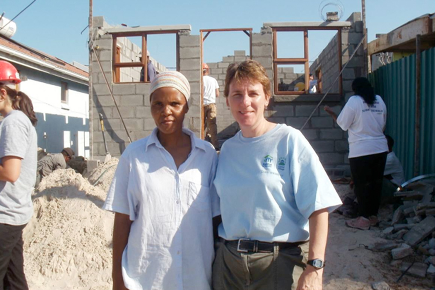 Johan posing for photo with Habitat for Humanity representative 