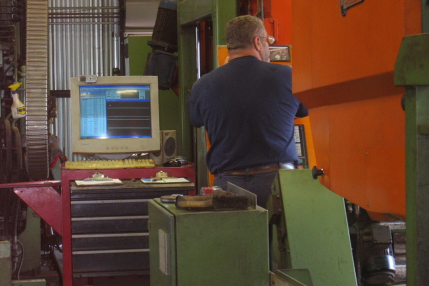 man working a steel fabrication machine