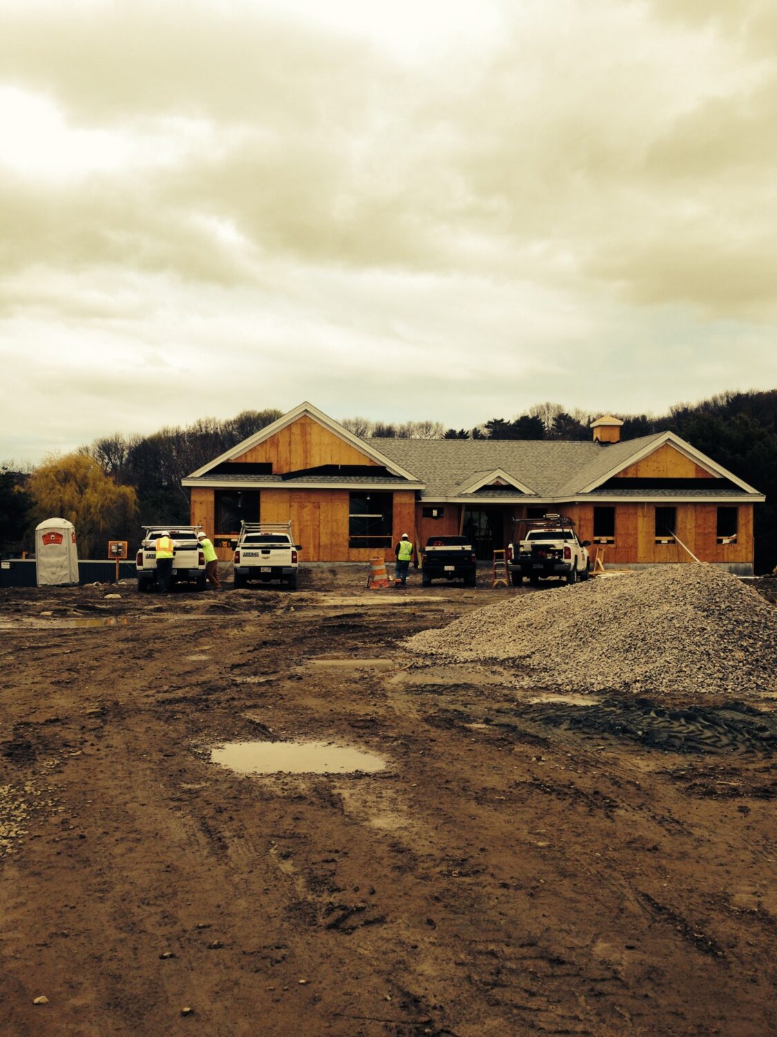 Wood framing is being built on the concrete foundation.