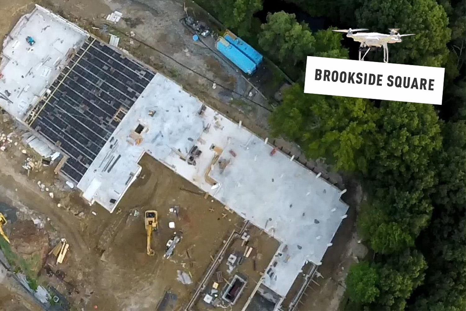 aerial view of Brookside Square, with drone holding a "Brookside Square" sign 