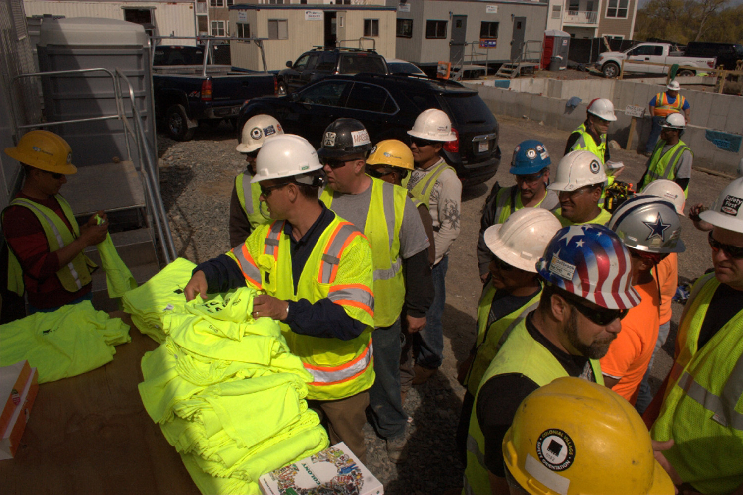 Workers gather to receive their free T-shirts.