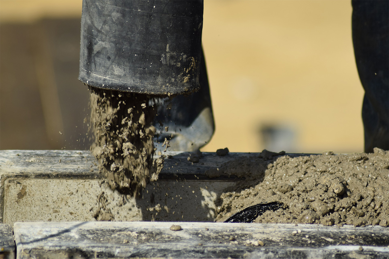 concrete being poured into tube 