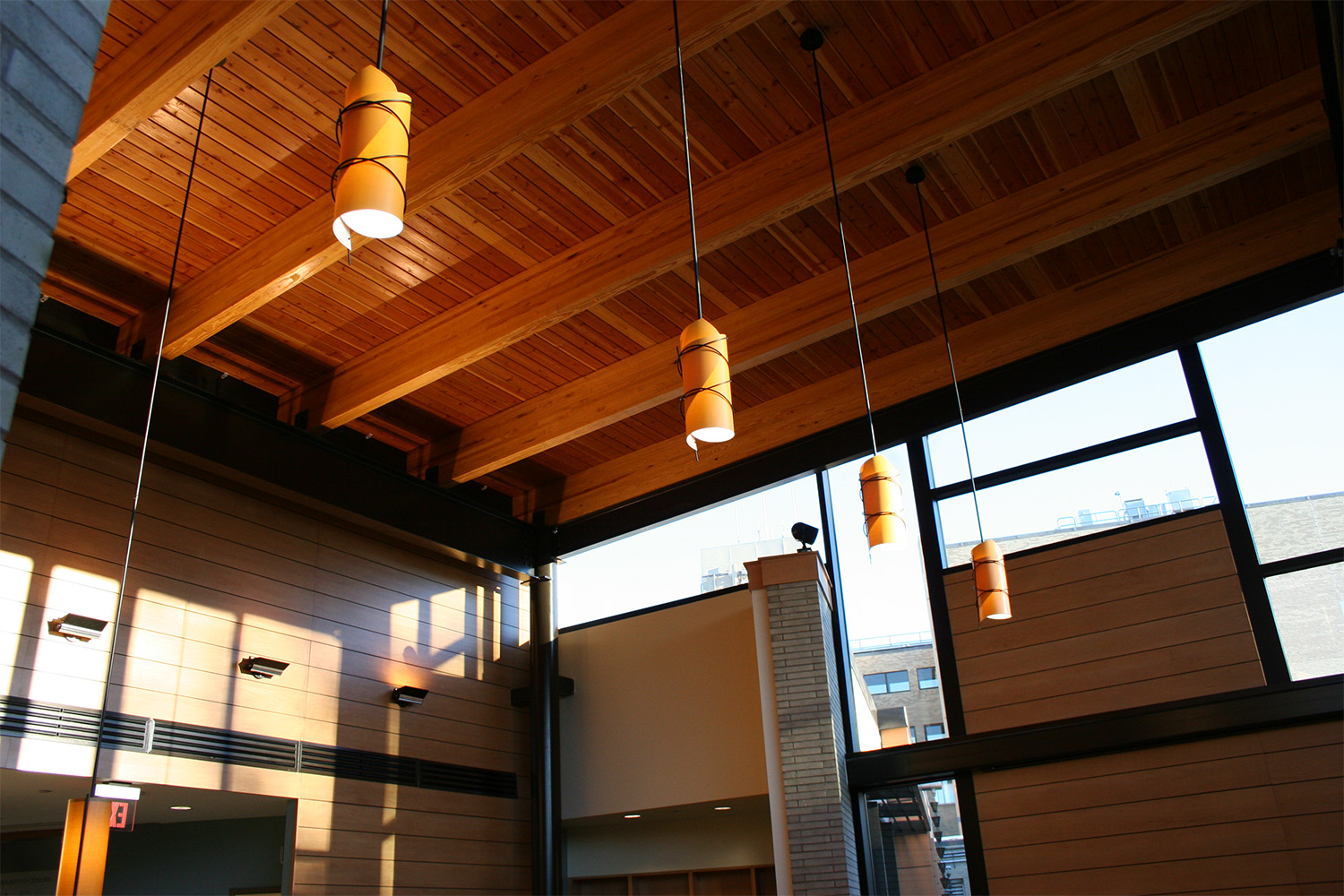 view of wooden ceiling at Marlborough Hospital, with hanging light fixtures 