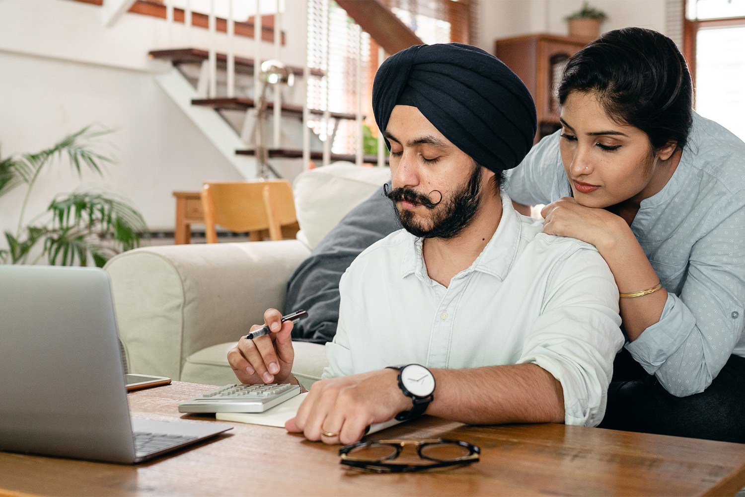 man with wife in front of computer 