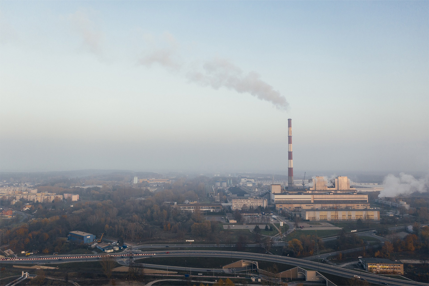gas emissions from gas chamber at factory, seen from a distance