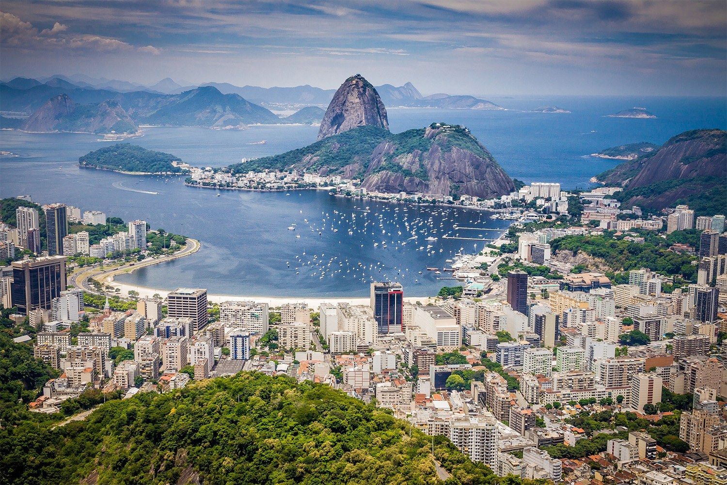 view of Rio de Janeiro next to the ocean, seen from an elevated distance 