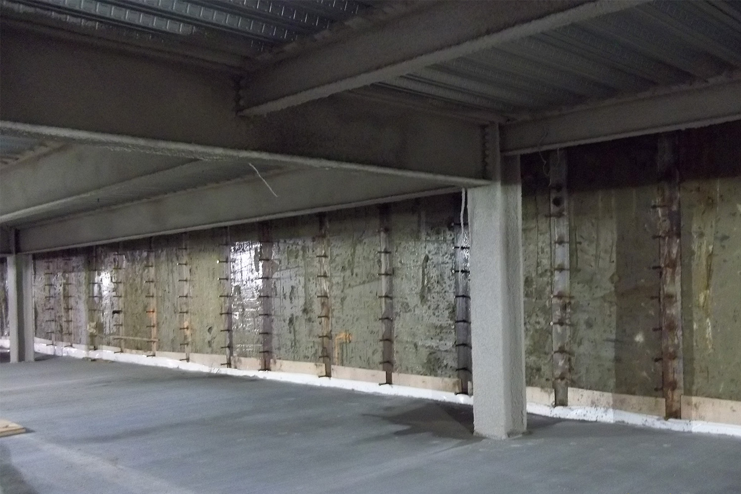 inside view of soil mix wall with studded soldier piles 