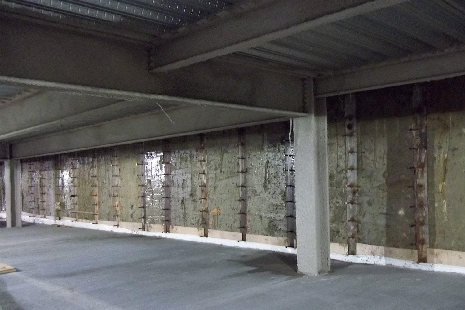 inside view of soil mix wall with studded soldier piles