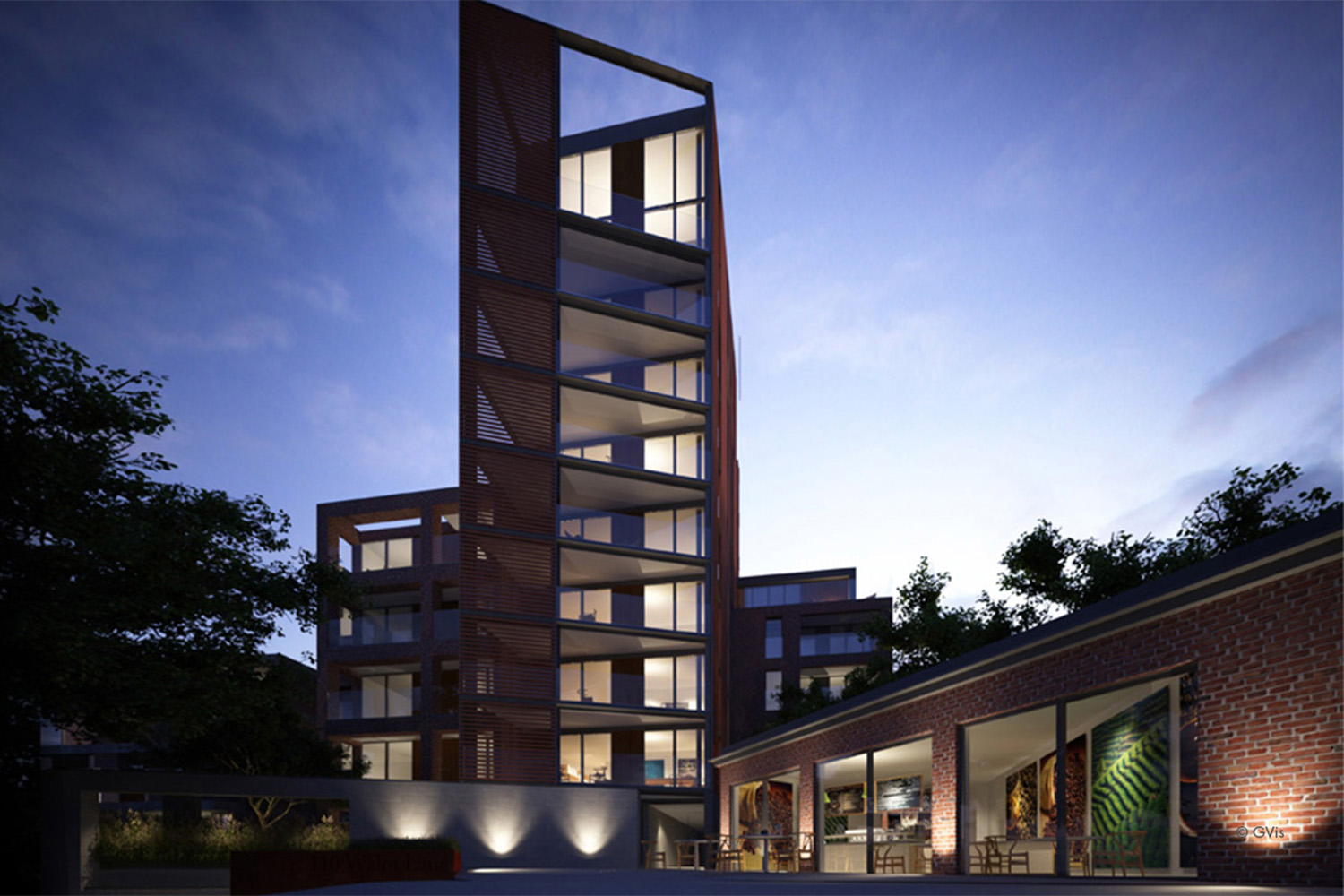 a long building with tall column, at night time