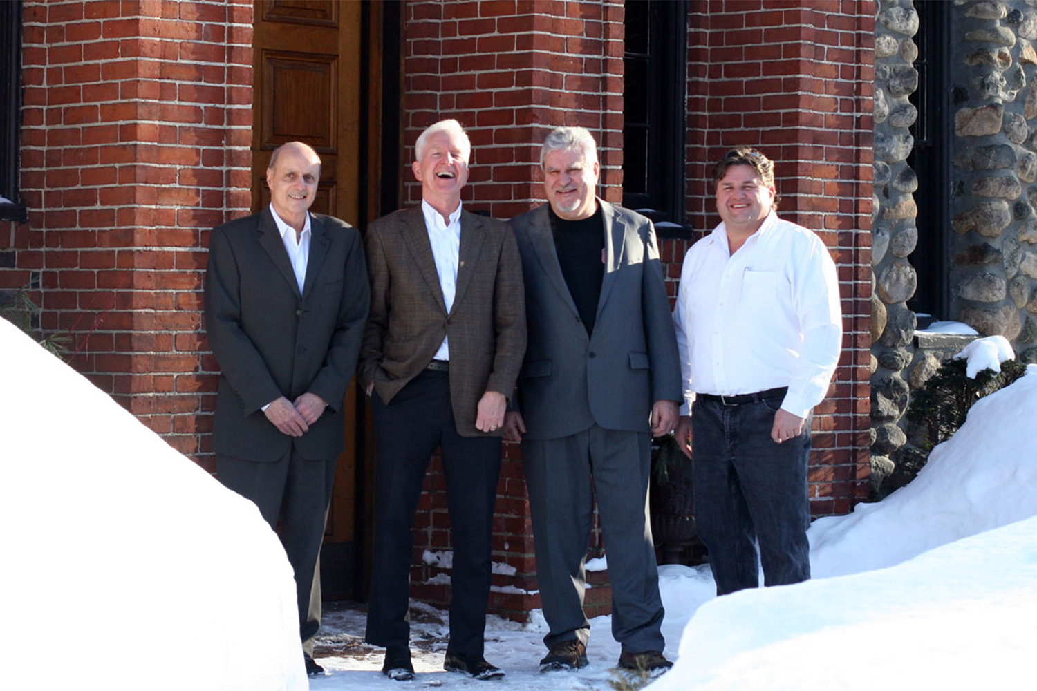 John Tocci posing for photo alongside representatives from NERCC 