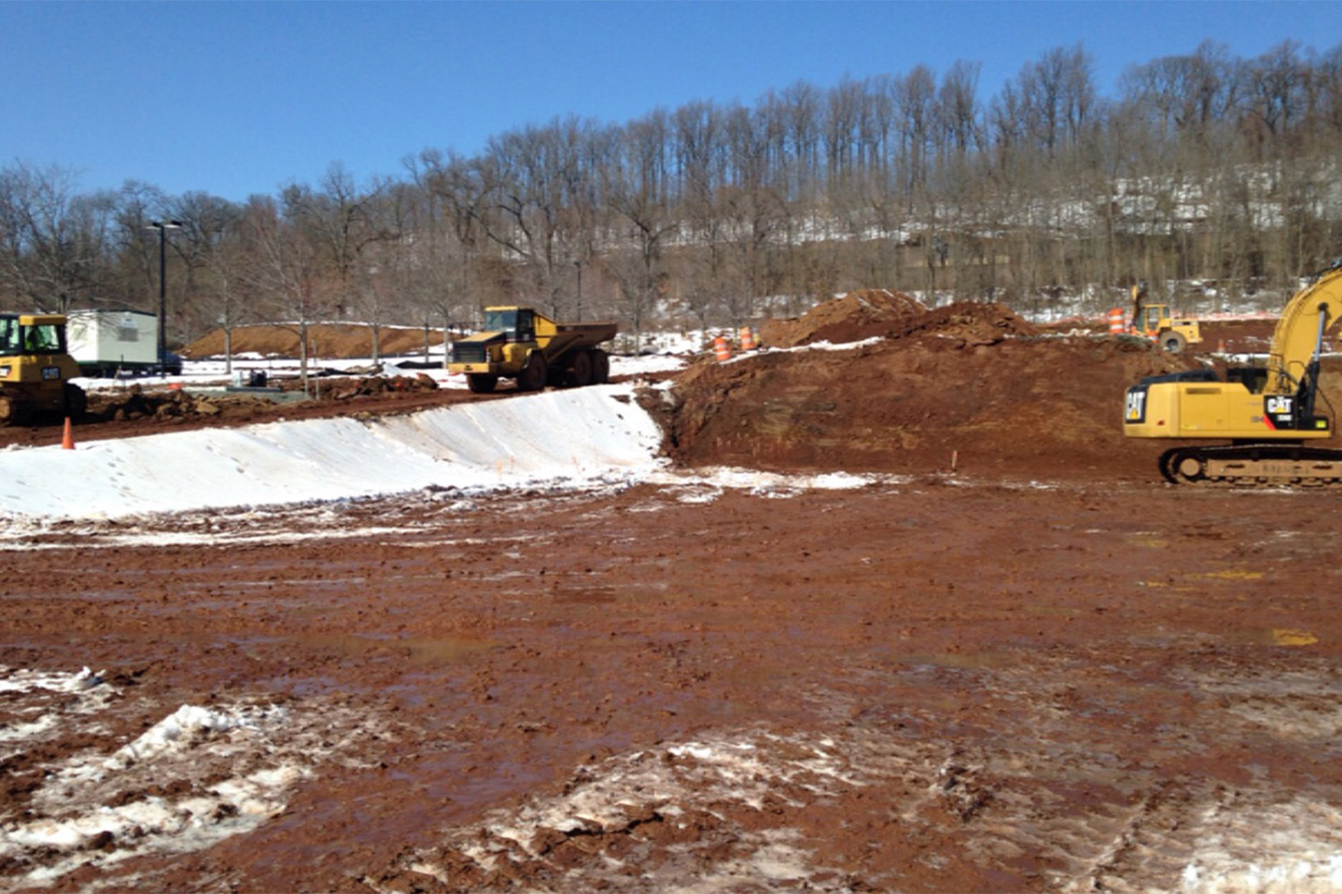 construction site with roller on top on dirt 