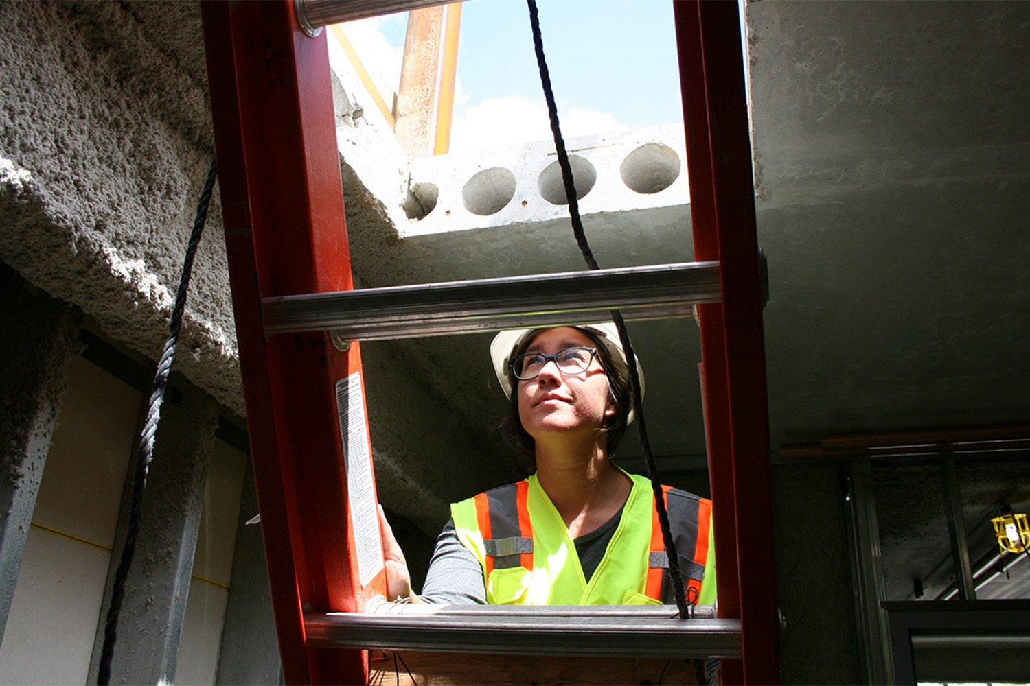 Jessica climbs to the highest reaches of the building