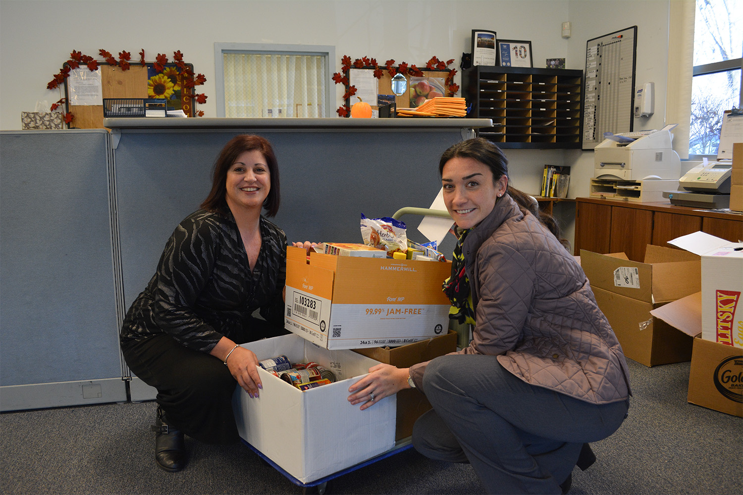 Tammi and Katie sorting through food pantry donations 