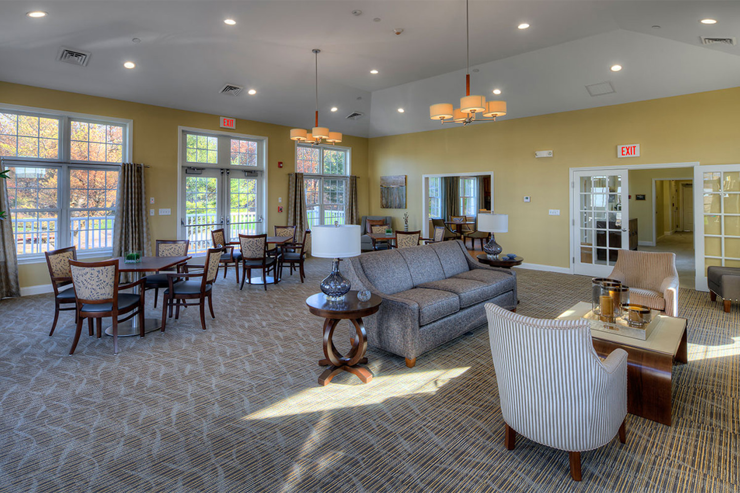 recreation room with couches, chairs, and coffee tables 