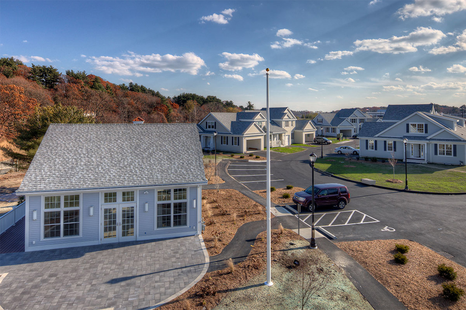 drone view of LIFE colonial village, with focus on house in the bottom left corner 